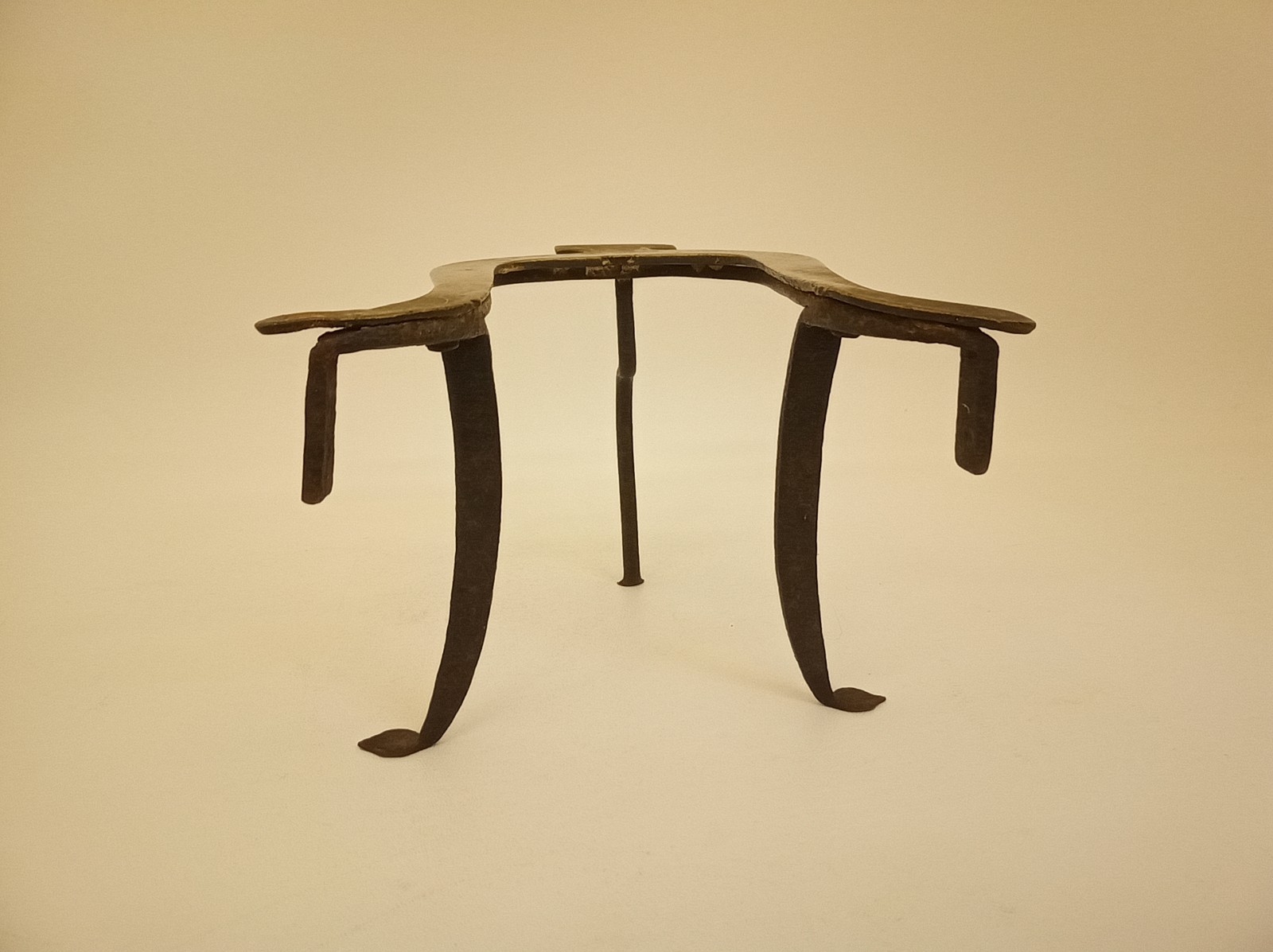 Antique primitive wrought iron standing trivet brass top Pennyslvania Dutch