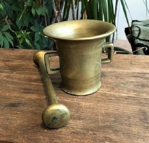 Early solid brass mortar and pestle