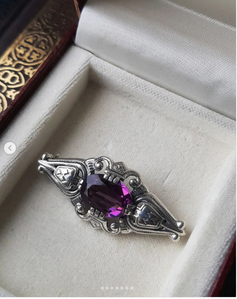 This antique silver beauty brooch is an illustration of one of the gods of Scand