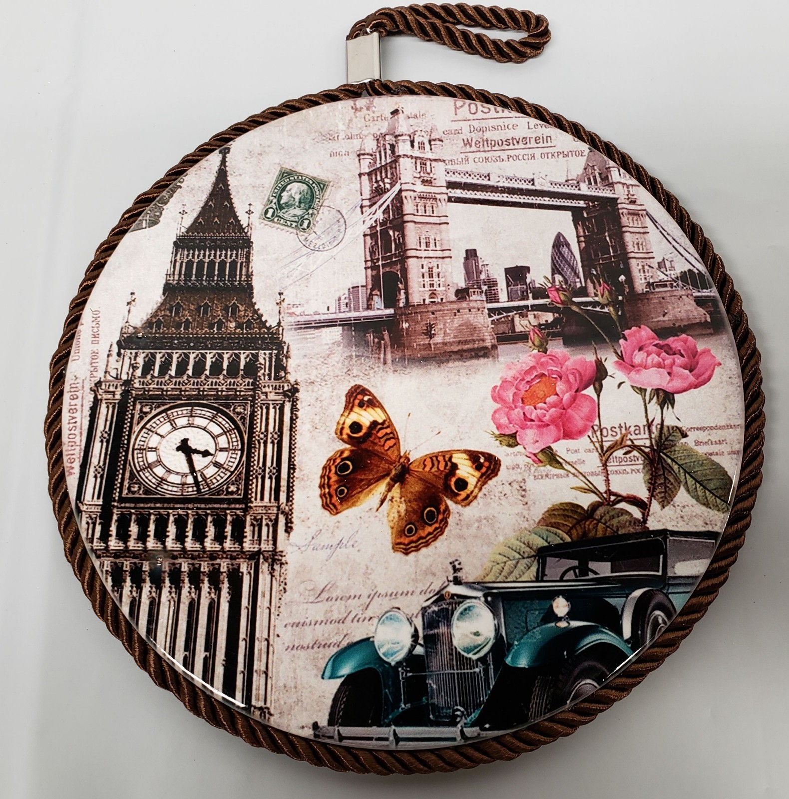 1 ROUND PLASTIC WALL PLAQUE w/cork back, 7″, BUTTERFLY & FLOWERS IN LONDON,brown