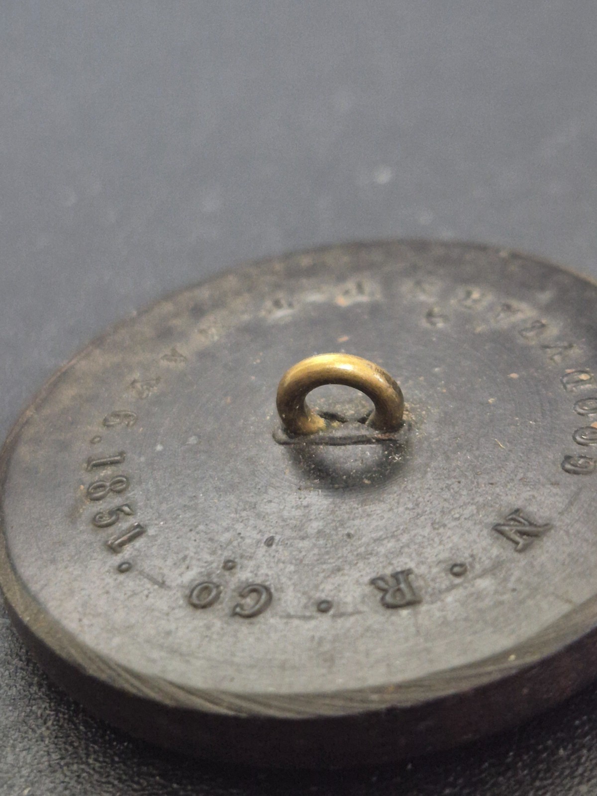 Antique 1851 Goodyear hard rubber button made by the Novelty Rubber Co. (N.R.Co)