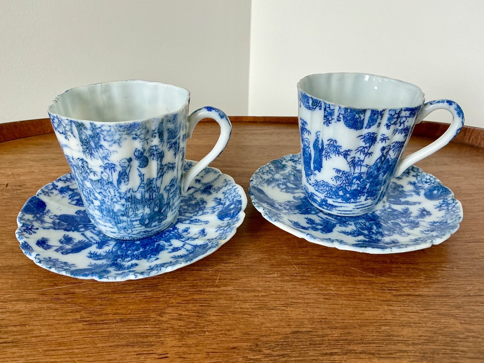 Antique Asian Blue & White Cups & Saucers Set of 2 Decorated w/ Sages w/defects