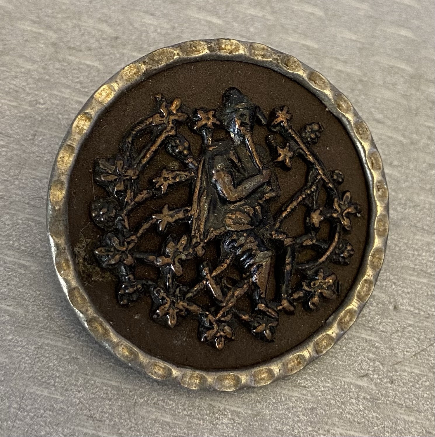 Antique Tinted Metal Picture Button Man With Pipe Flute Player in Garden 33mm
