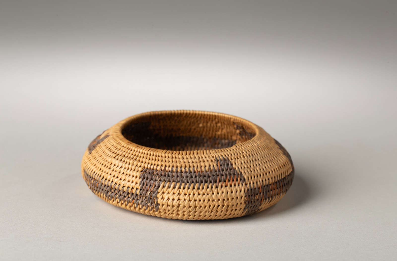 1900 Pomo Low Basket, Dark Band at Base, With Metal Tag