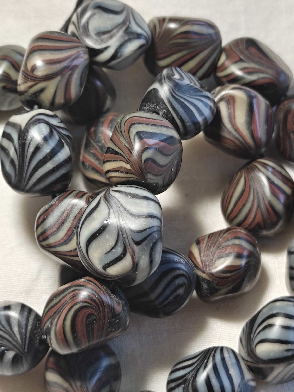Unusual antique lamp work glass trade bead strand. 128 grams, 18 inches long.