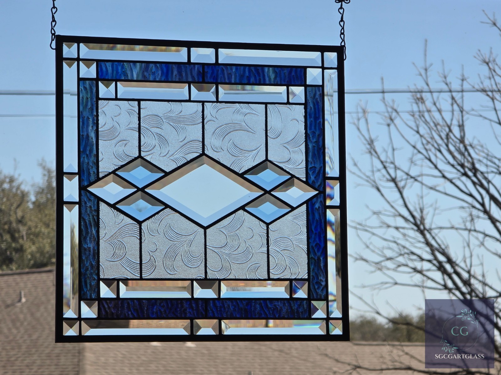 Blue Beveled stained glass window hanging, measuring 16 by 16 inches.