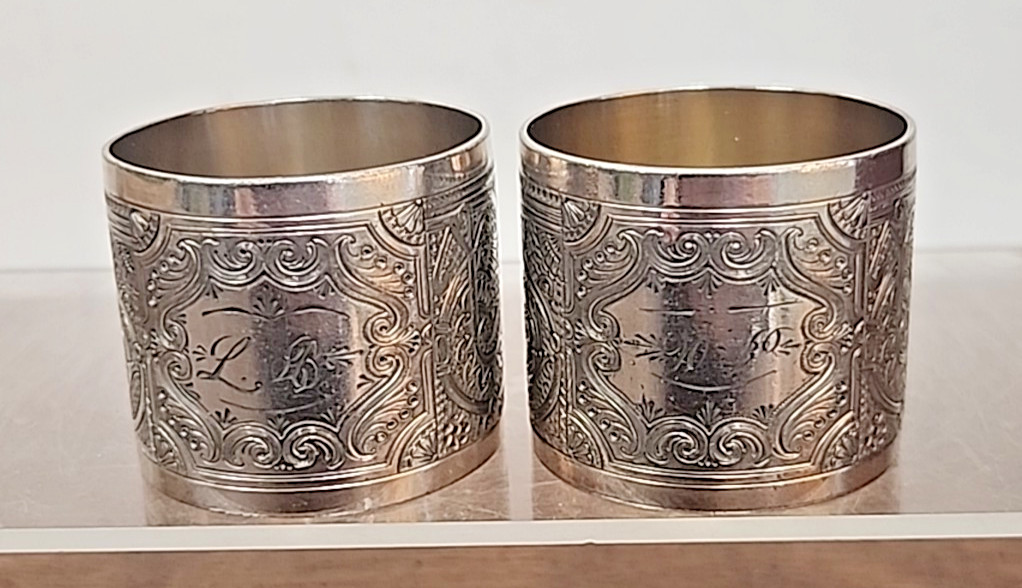 MATCHING ANTIQUE PAIR HIGH RELIEF ENGRAVED NAPKIN RING SET OF TWO