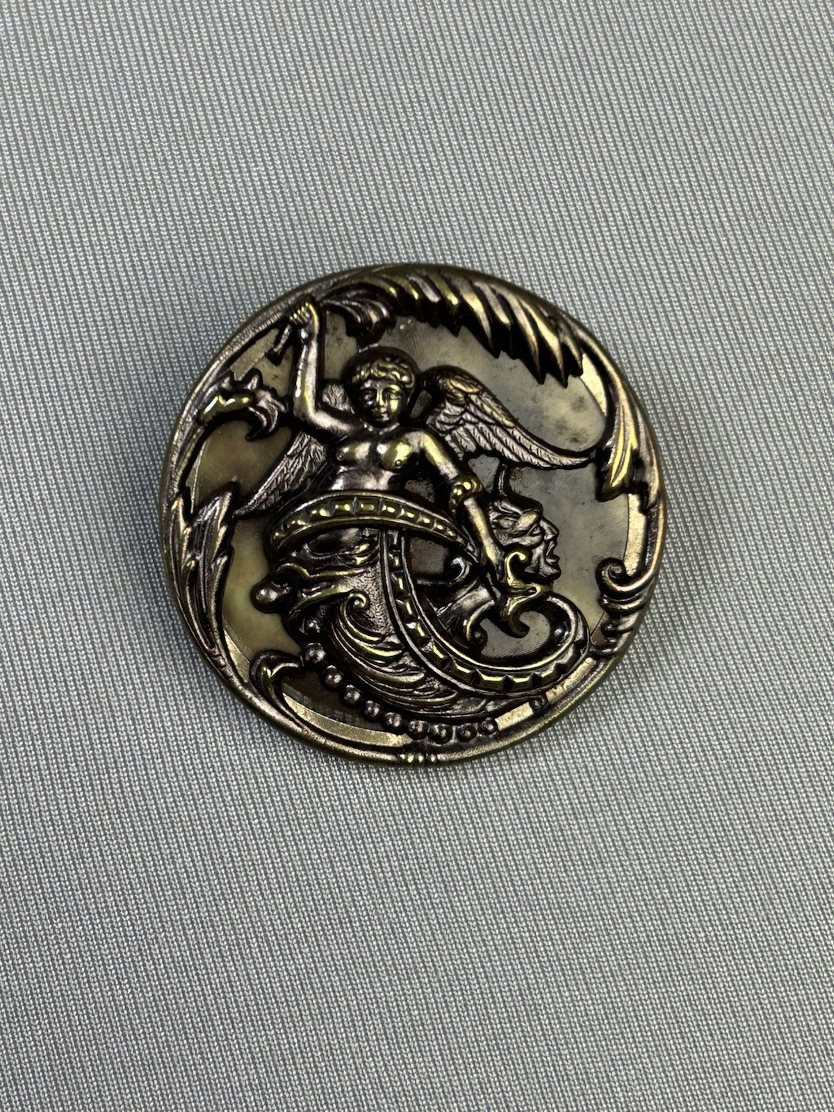 Cherub Riding A Sea Monster Antique Metal Loop Picture Button