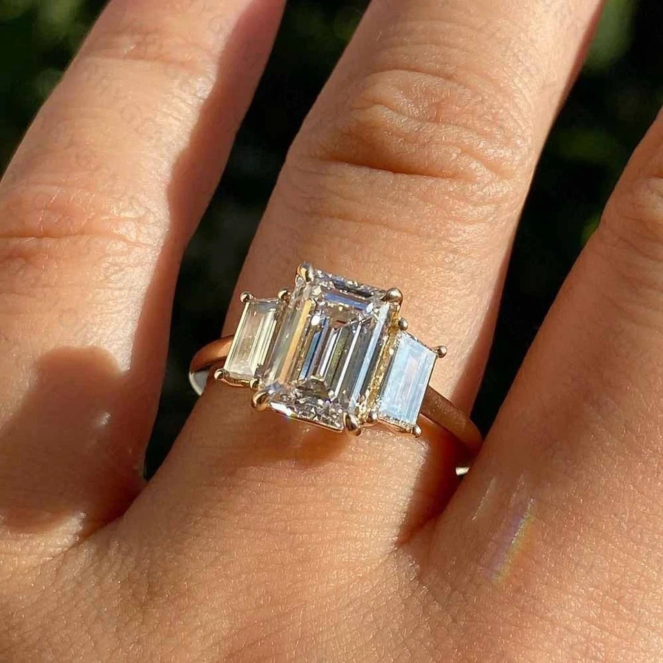 3Ct Emerald Cut Lab Created Diamond Three Stone Ring 14K Yellow Gold Plated