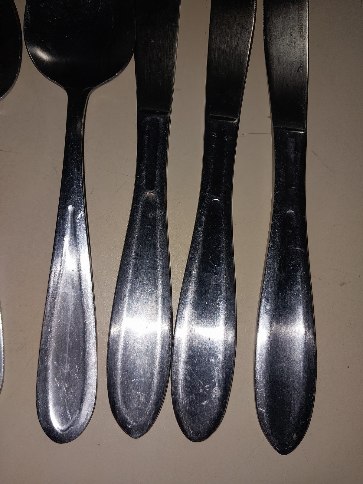 2 spoons & 3 knives farberware used