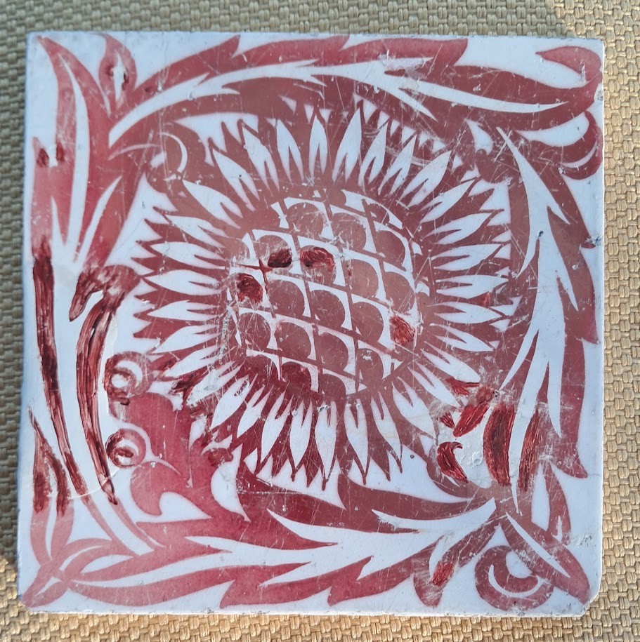 William De Morgan red lustre sunflower tile