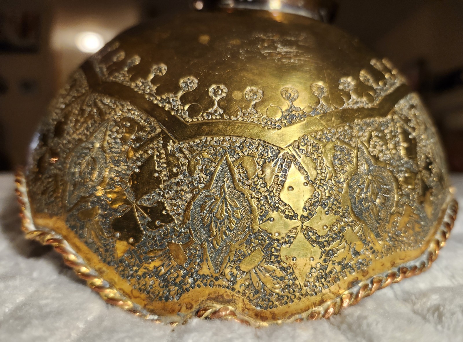 Antique Middle Eastern brass decorative set with engraved floral motifs.