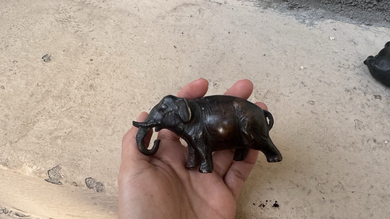 A JAPANESE MEIJI PERIOD (1868-1912) BRONZE WATER DROPPER MODELLED AS AN ELEPHANT