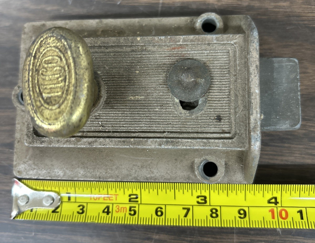 Vintage ILCO spring loaded lockable deadbolt lock with brassy turn knob