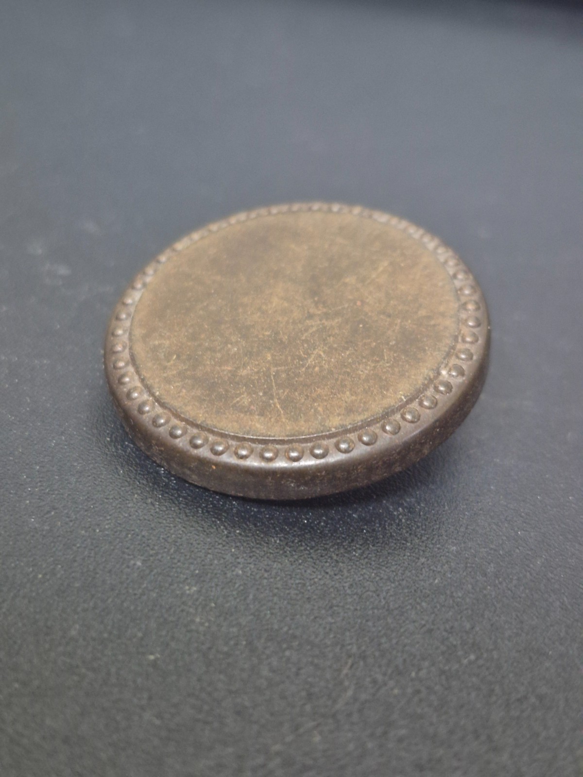 Antique 1851 Goodyear hard rubber button made by the Novelty Rubber Co. (N.R.Co)