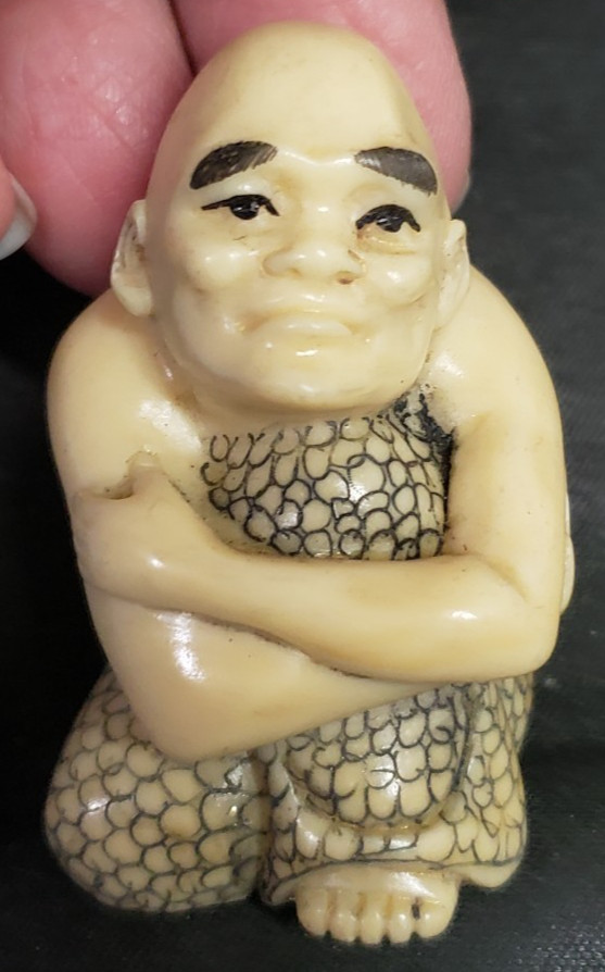 Japanese Carved Resin Netsuke Man Hugging Self Asian Figure