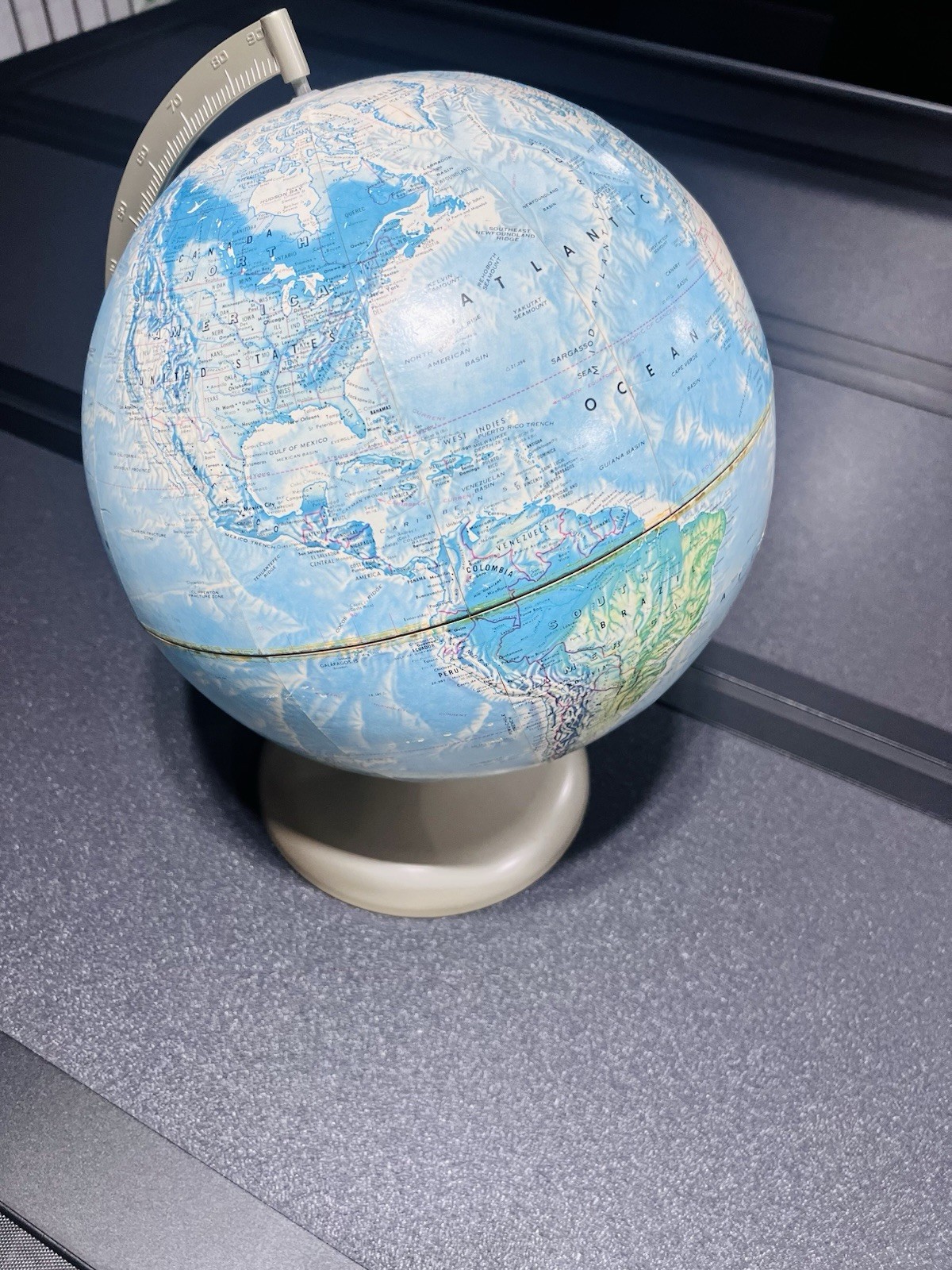 Vintage Rand McNally World Portrait Globe with a Metal Base