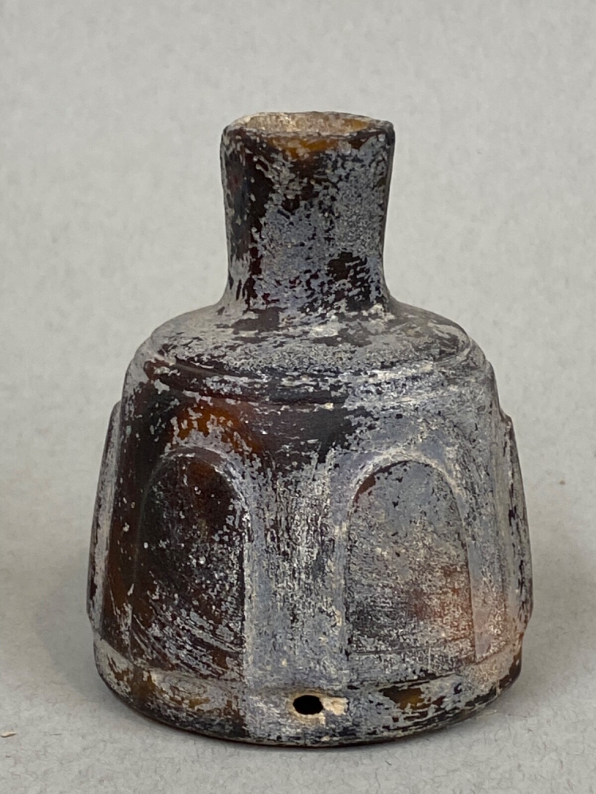 Islamic Cut Glass Bottle, ca. 9th-10th Century CE; ht: 3 3/4”; diameter: 3”