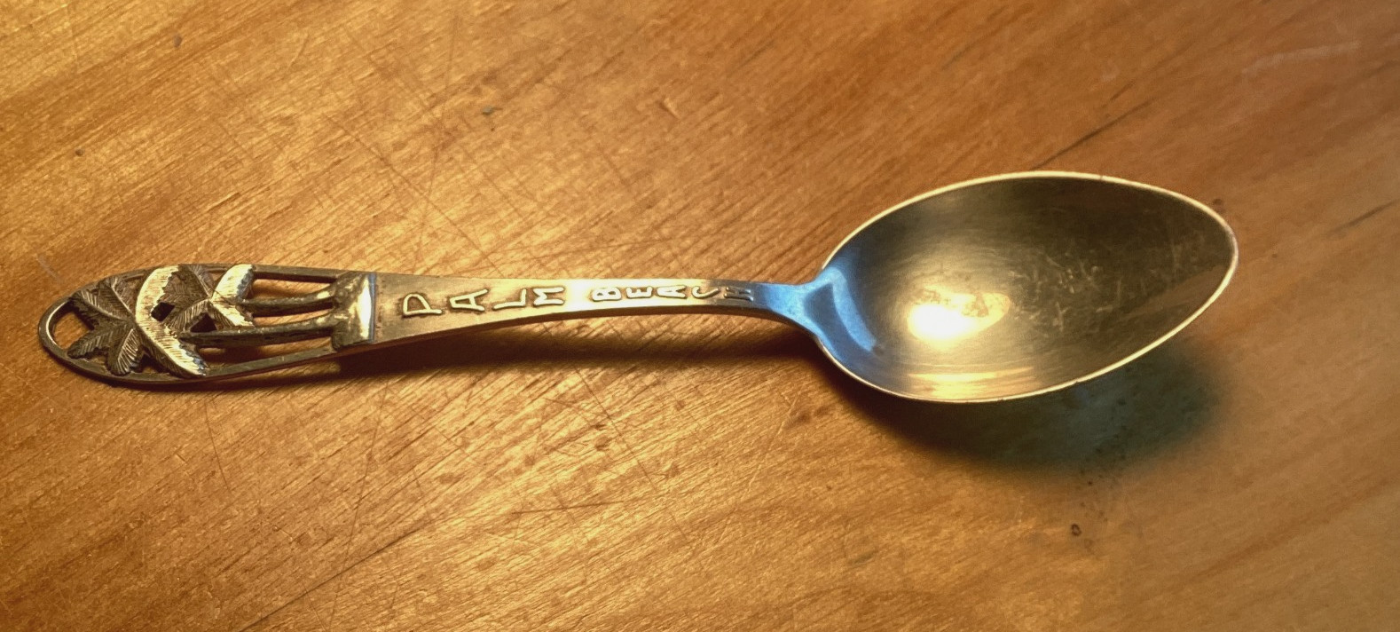 Palm Beach Tea Spoon, showing two palm trees,Sterling, no date