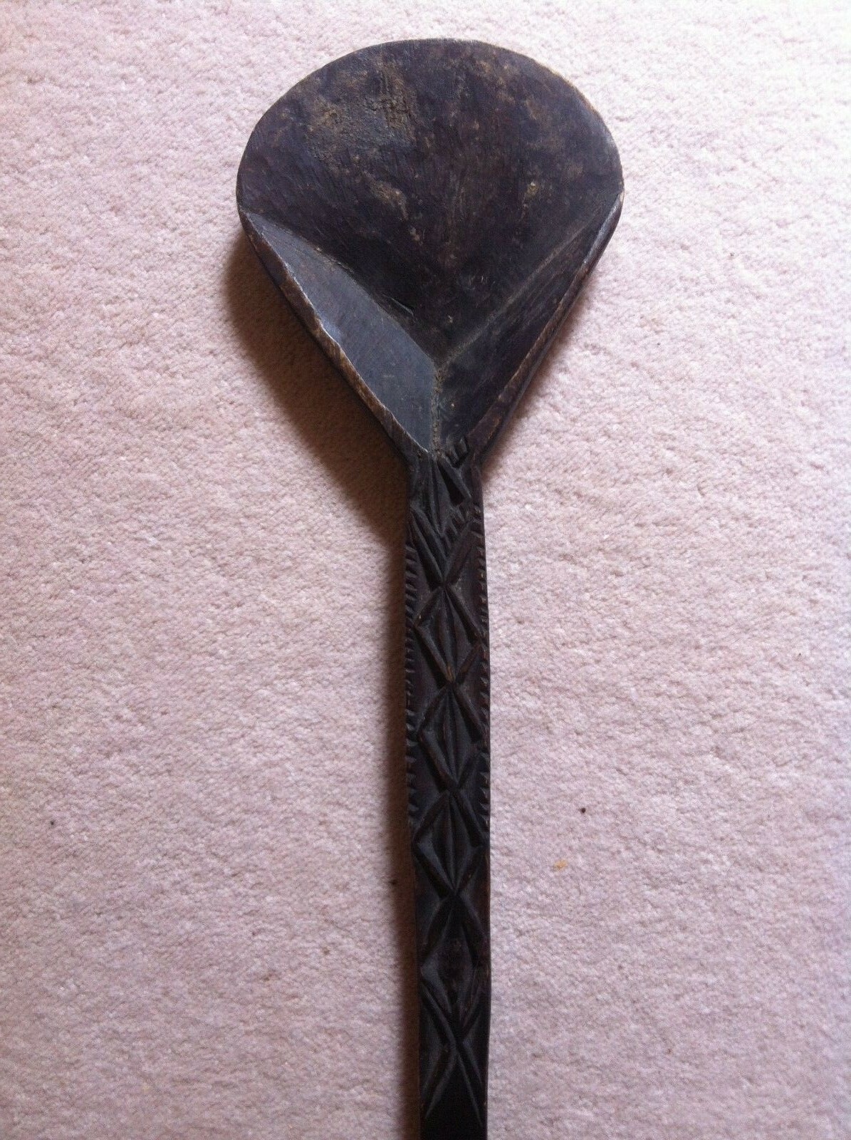 A large antique african laddle, tribal art.