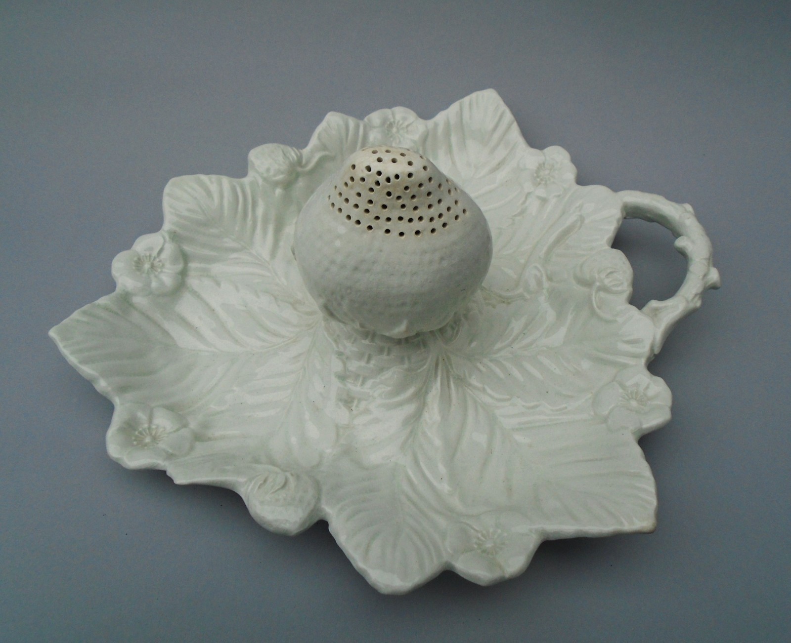 Ivory white glazed earthenware strawberry dish leaf form with sugar berry caster