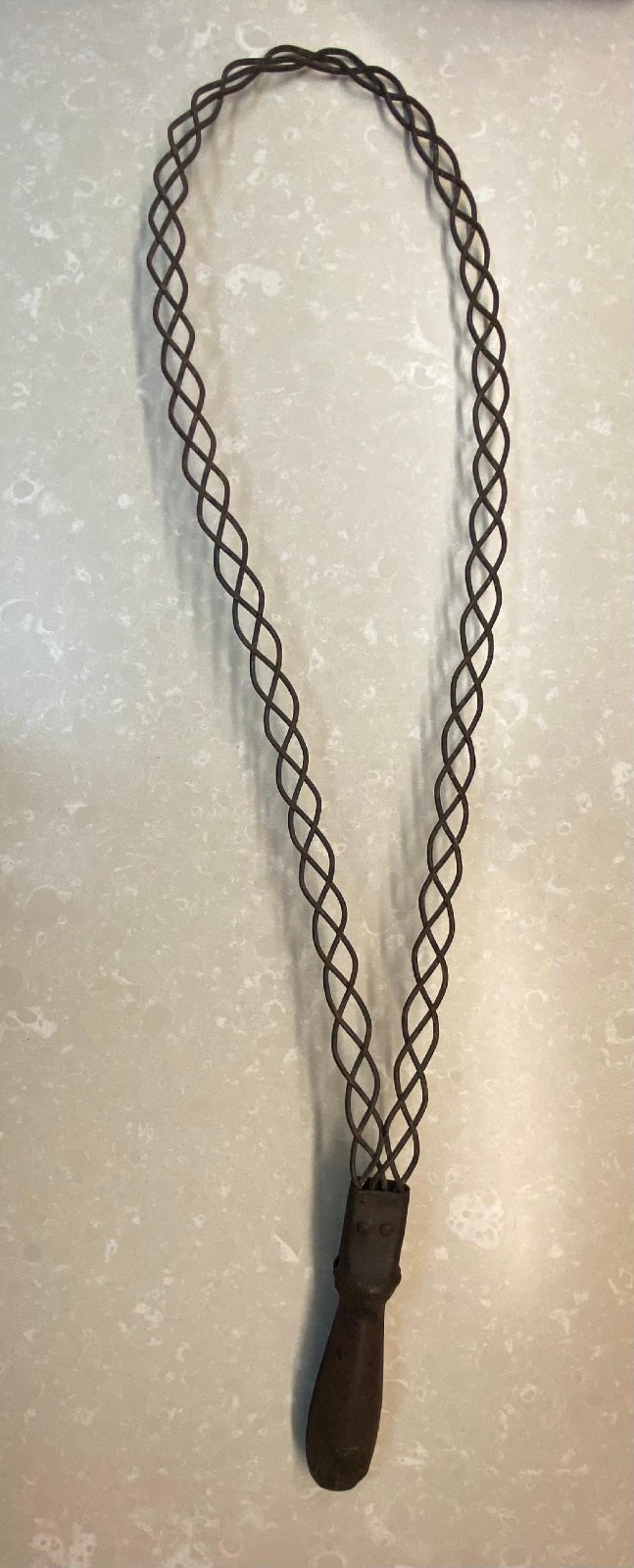ANTIQUE METAL RUG BEATER WITH RARE METAL HANDLE