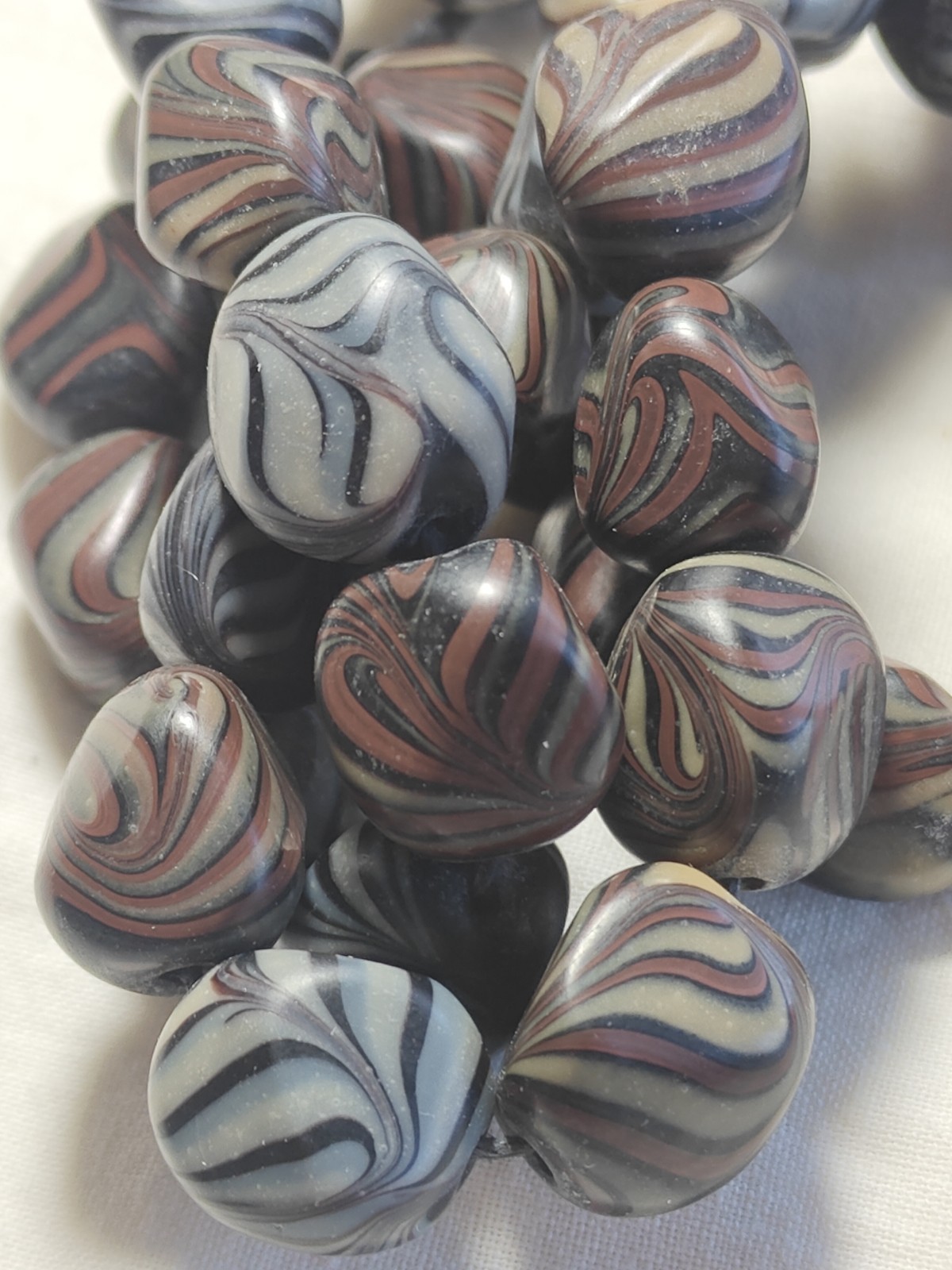 Unusual antique lamp work glass trade bead strand. 128 grams, 18 inches long.