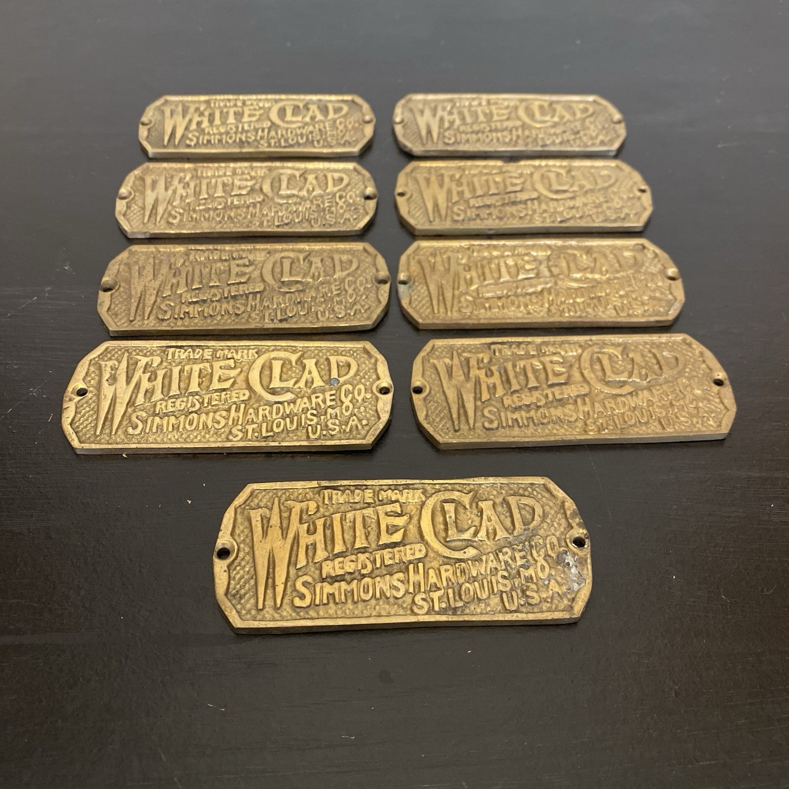 Vintage White Clad Simmons Hardware Co Brass Embossed Nameplate Tag St Louis MO