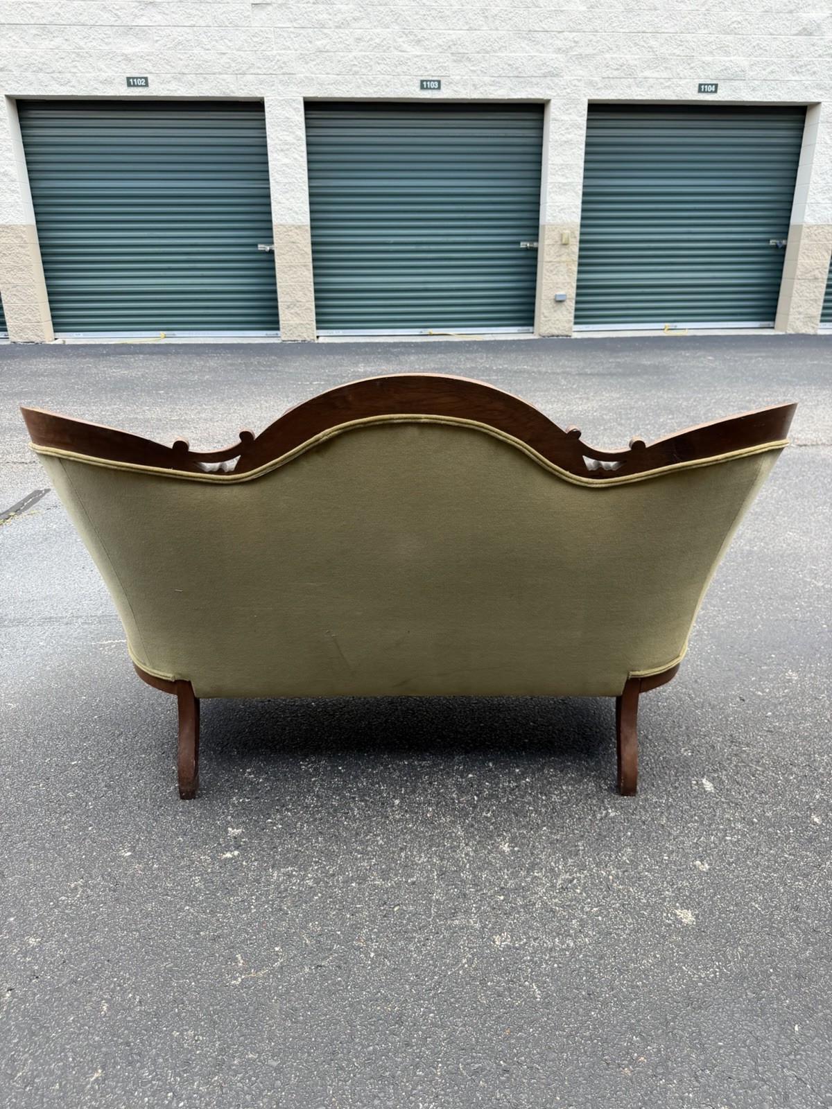 Antique Victorian settee with Green Velvet Upholstery & Carved Wooden Back