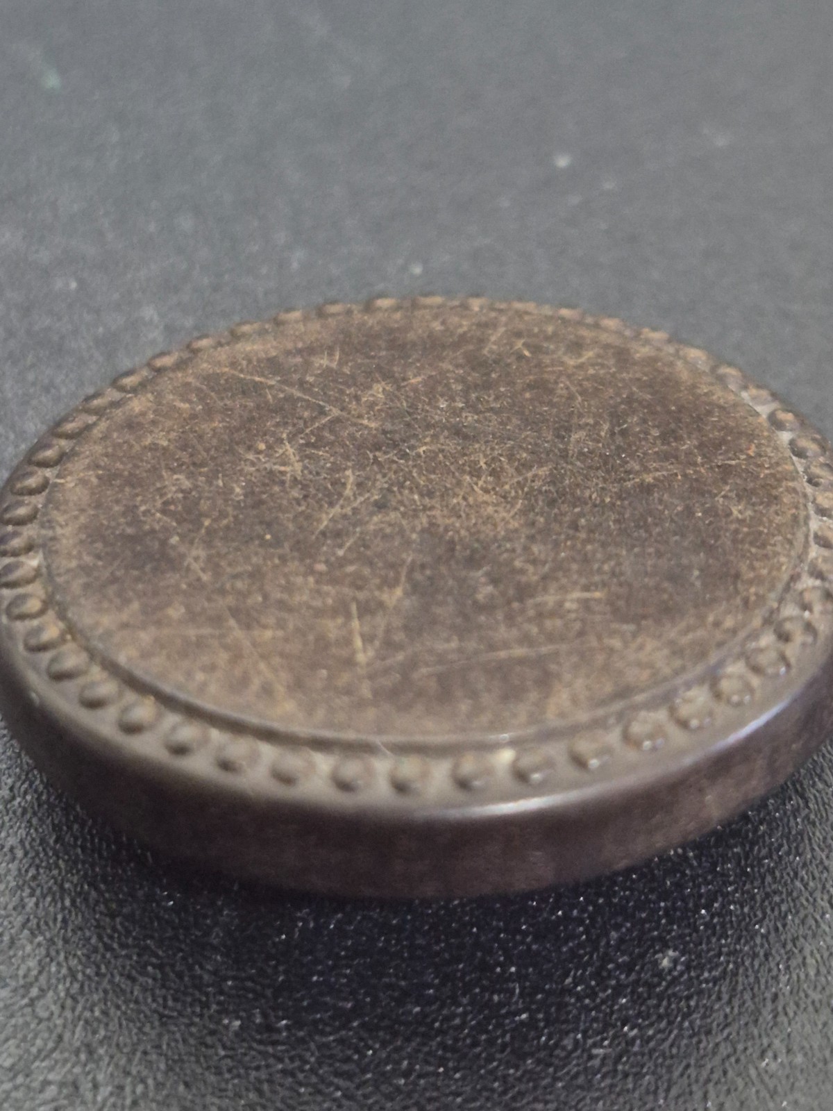Antique 1851 Goodyear hard rubber button made by the Novelty Rubber Co. (N.R.Co)