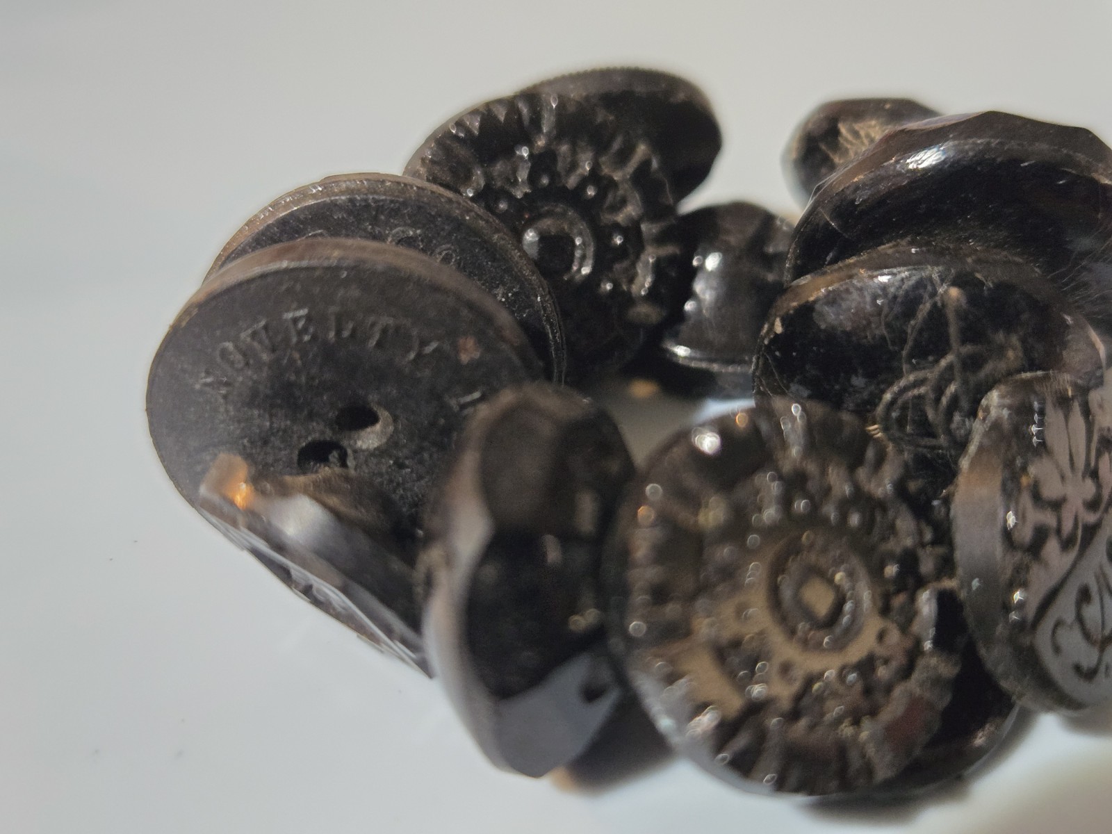 Charm String Buttons Novelty Rubber Co. Whistles Pictoral Pressed Black Glass