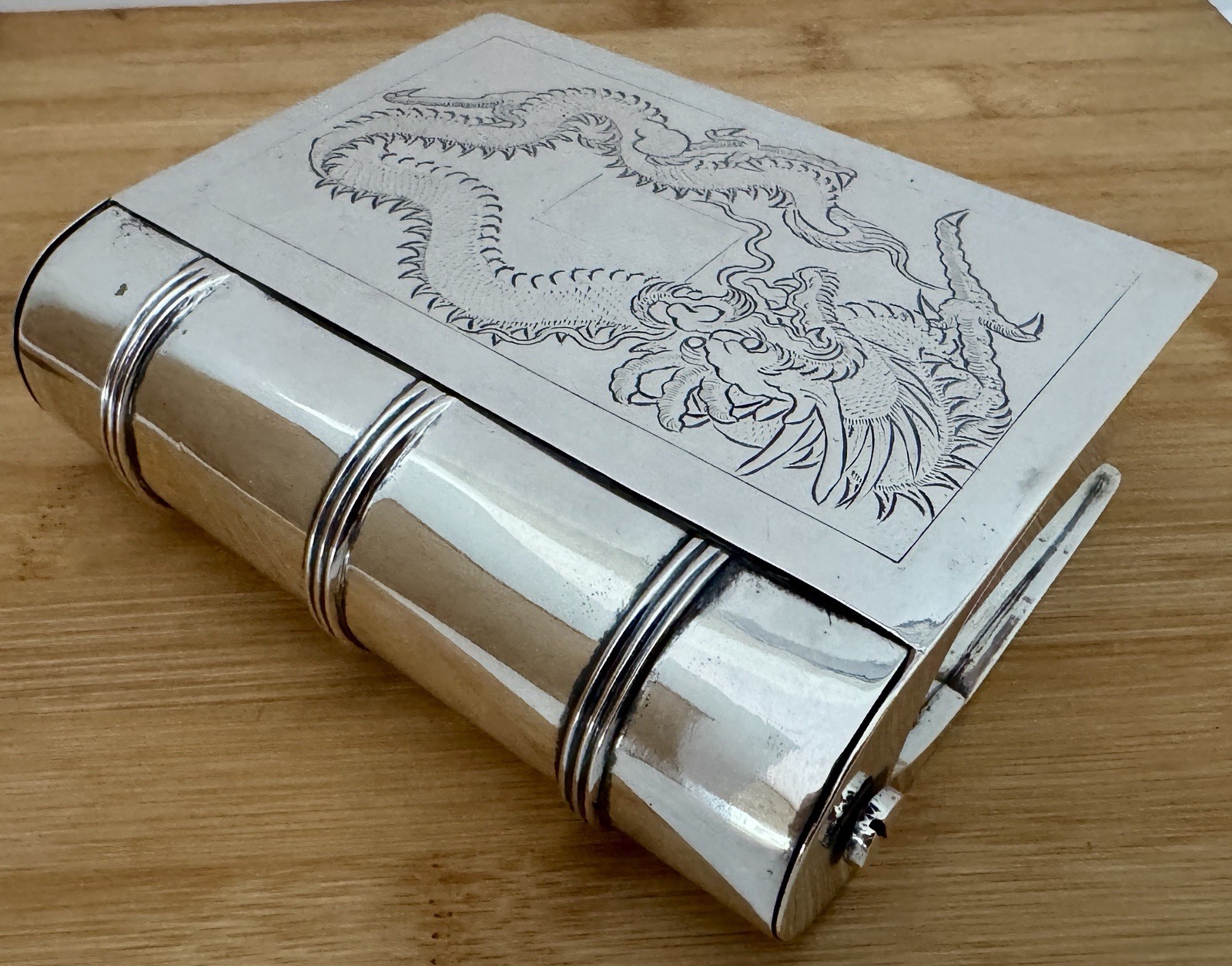 FIGURAL BOOK FORM STERLING SILVER TABLE BOX WITH ENGRAVED DRAGON ON IT’S LID