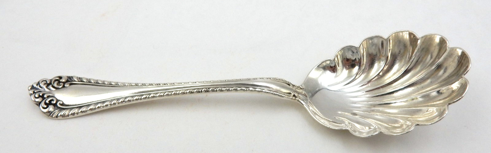 ANTIQUE ALVIN STERLING SILVER RUFFLED EDGE SUGAR SHELL SPOON, 31.1 GRAMS