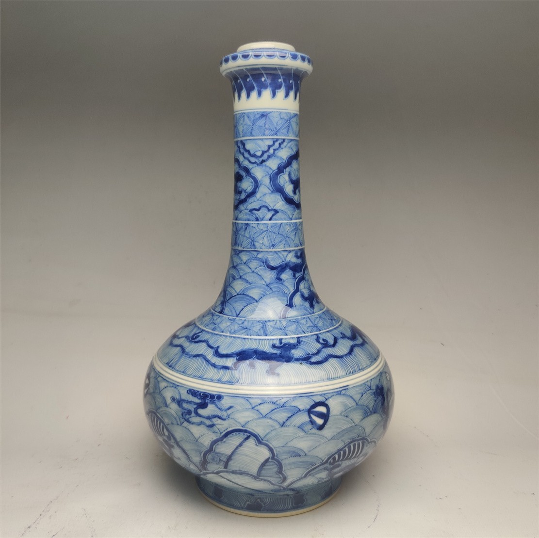 Qing Dynasty blue and white sea water dragon pattern bottle