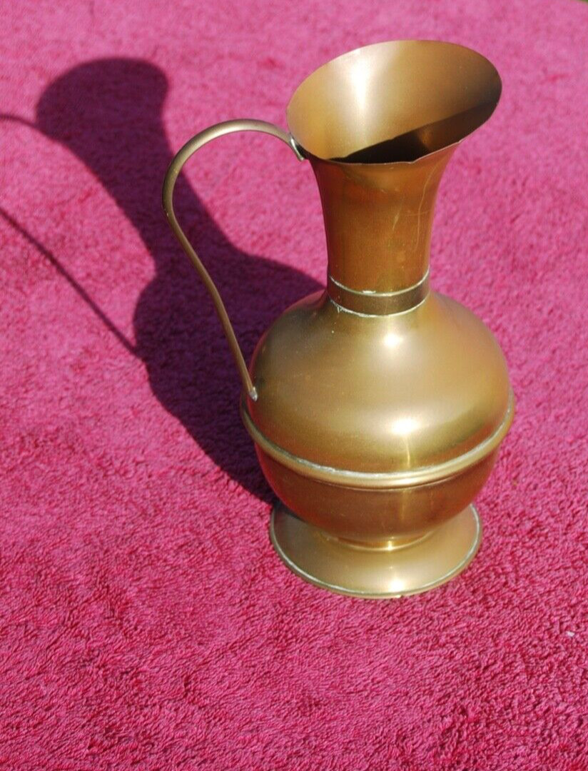 A vintage Brass jug 8 inches tall, very much 1960s 70s decor.