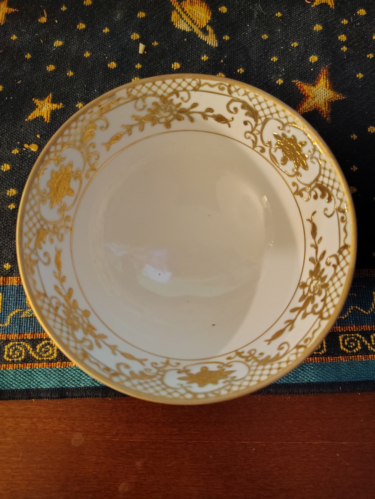 antique Noritake porcelain waste bowl, gold with a latticework, floral pattern.