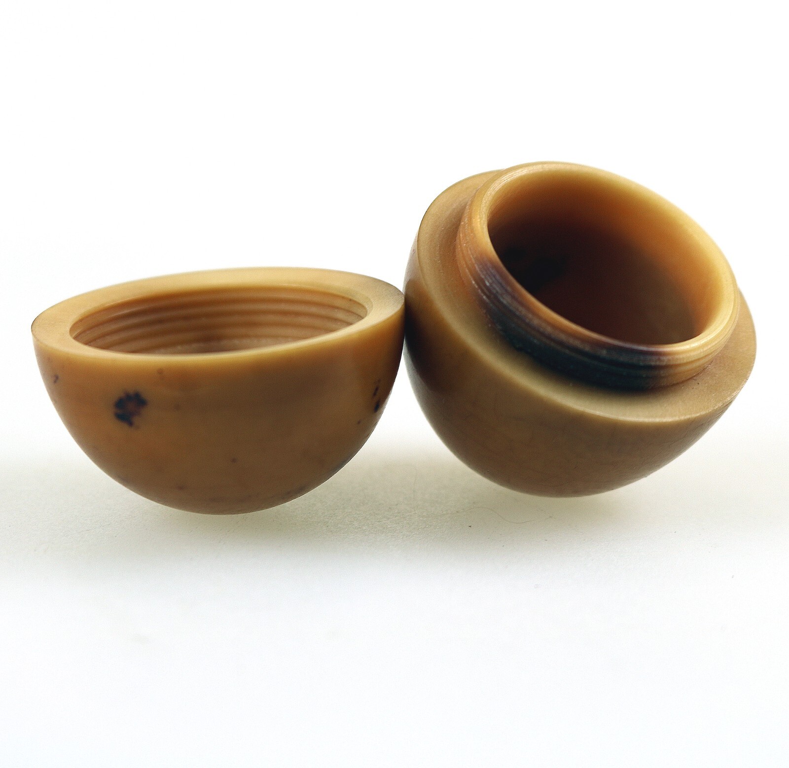 An unusual antique oriental threaded carved nut box on hardstone stand C.1900