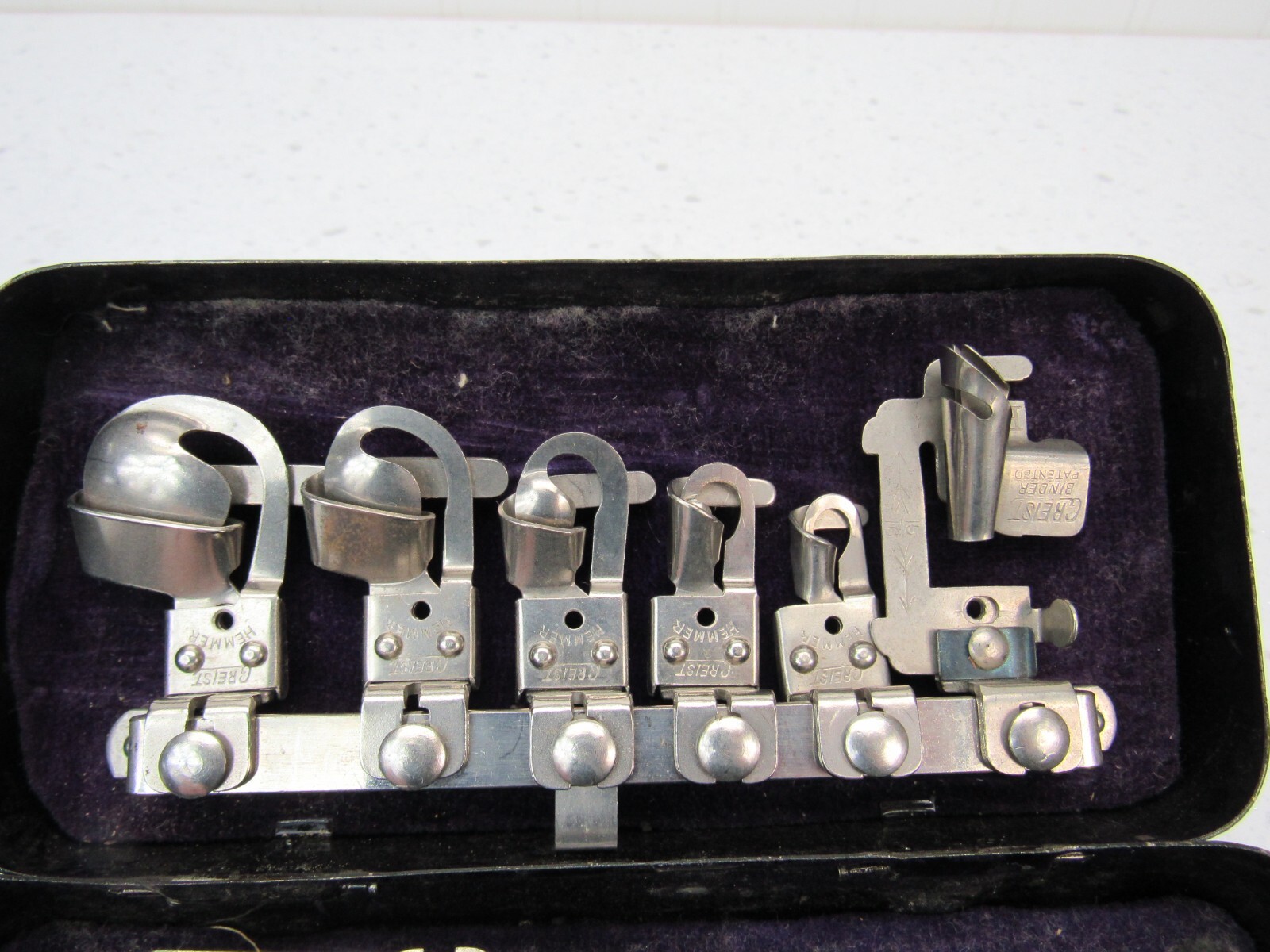 Antique Sewing Machine Attachments in original metal Box