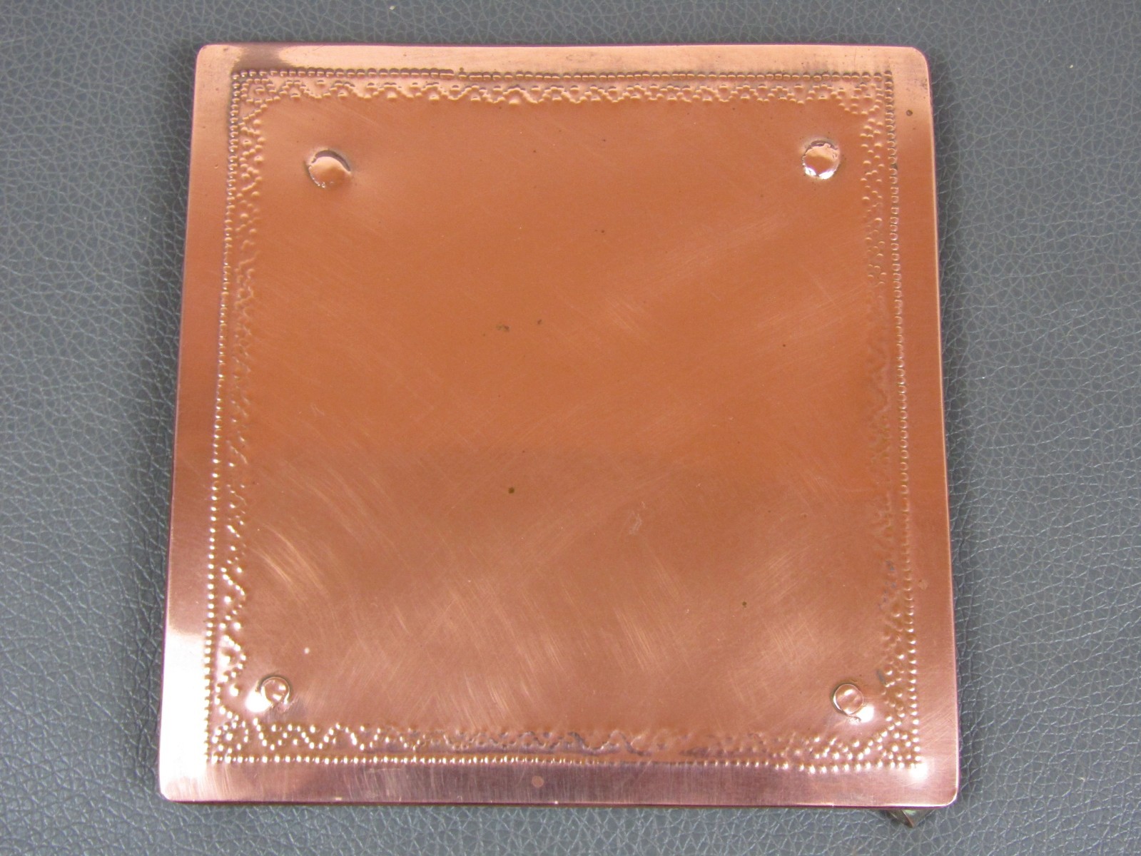 Antique Arts & Crafts riveted copper stand or trivet 5″