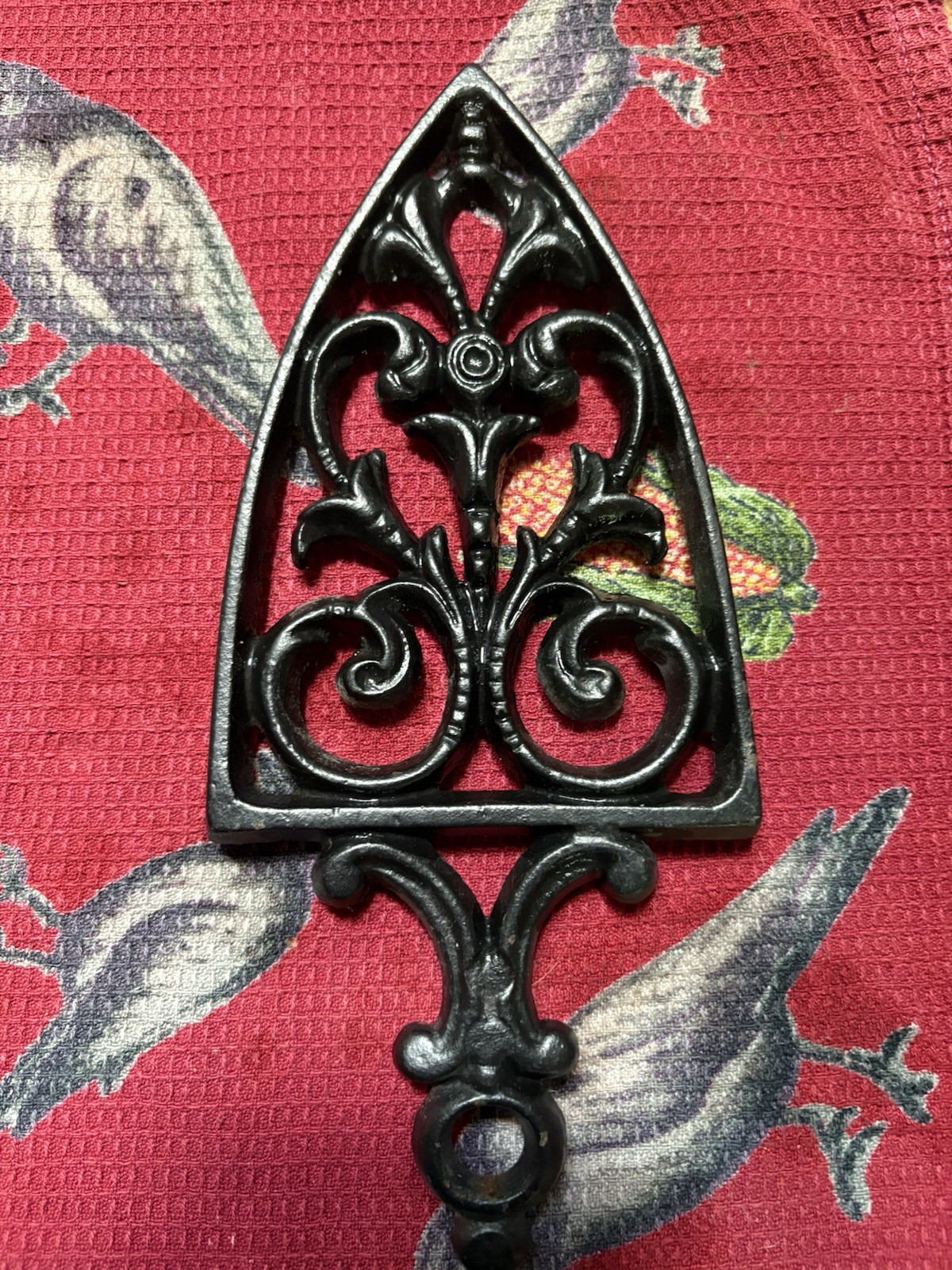 A signed 1955 Cathedral cast iron Footed trivet by artist John Z. Harner.