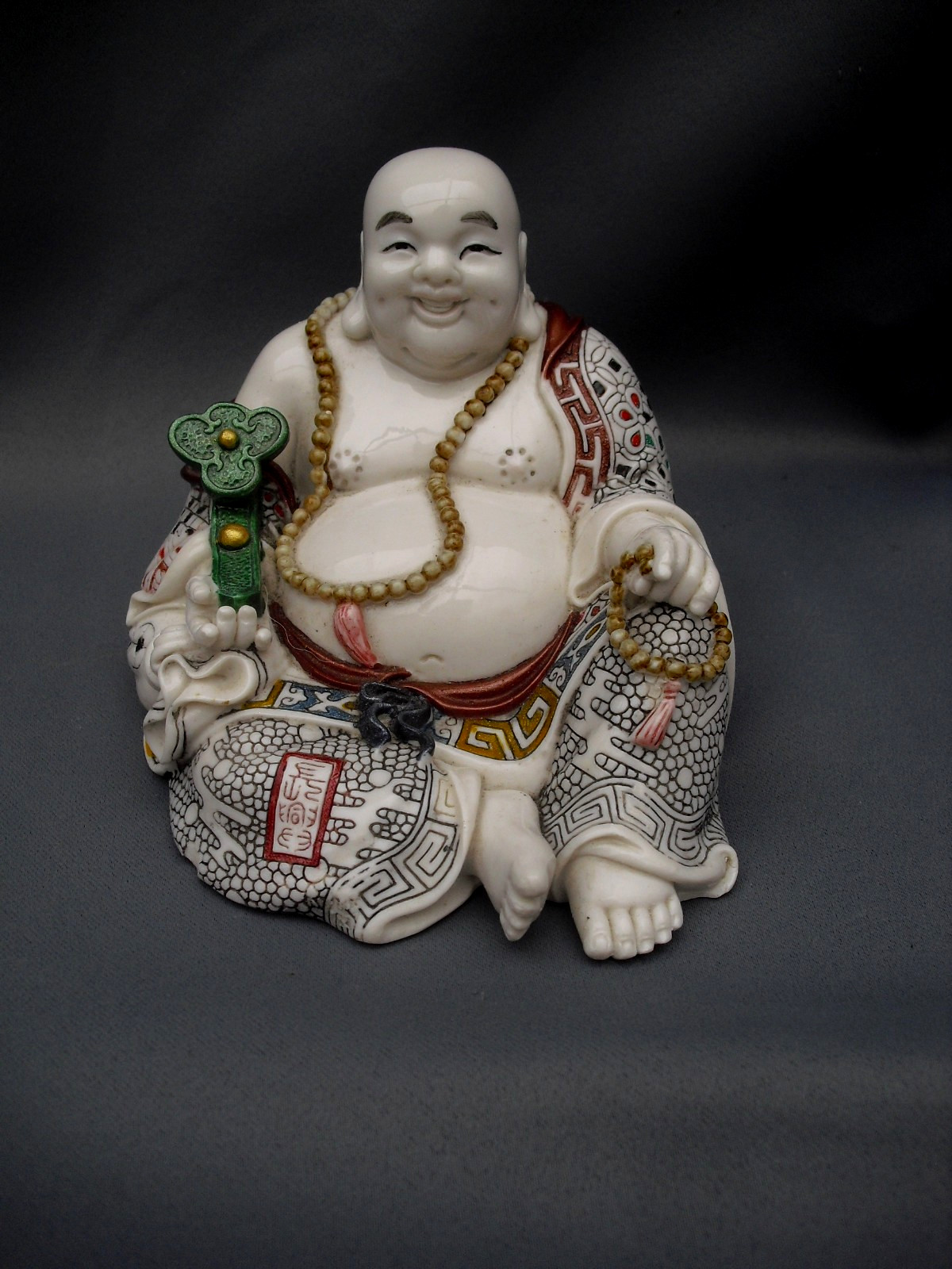 Ornate Satsuma style oriental Happy Buddha fine detail incised 11cm tall