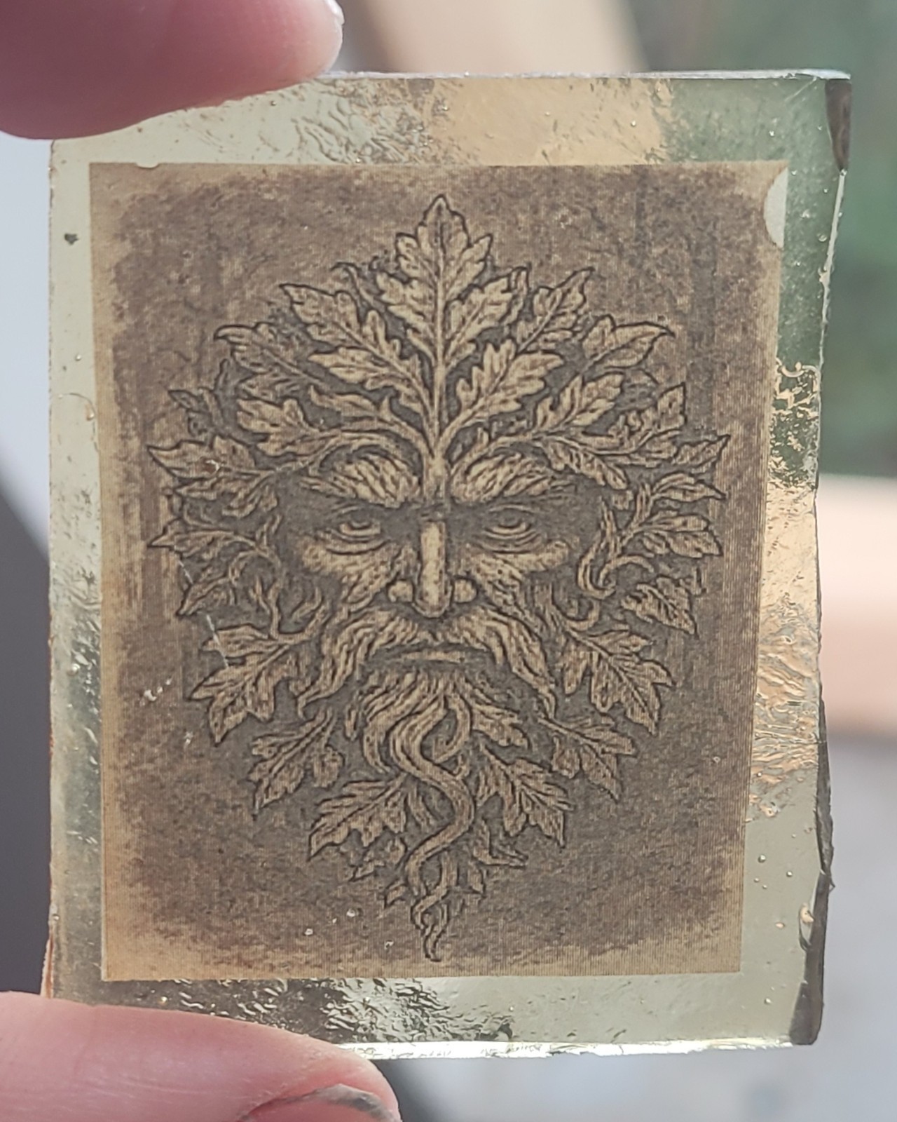 Stained glass Green Man piece fragment kiln fired amber glass