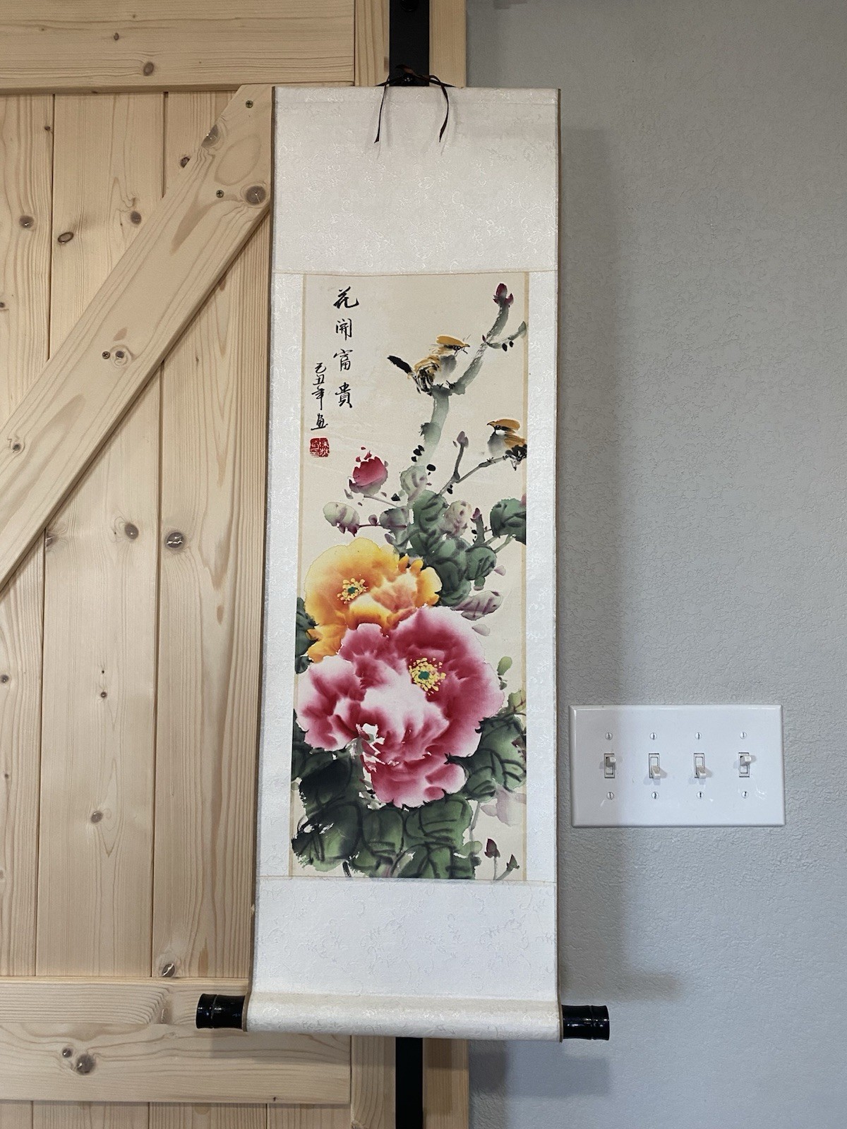 traditional Chinese wall scroll painting featuring peonies and birds.