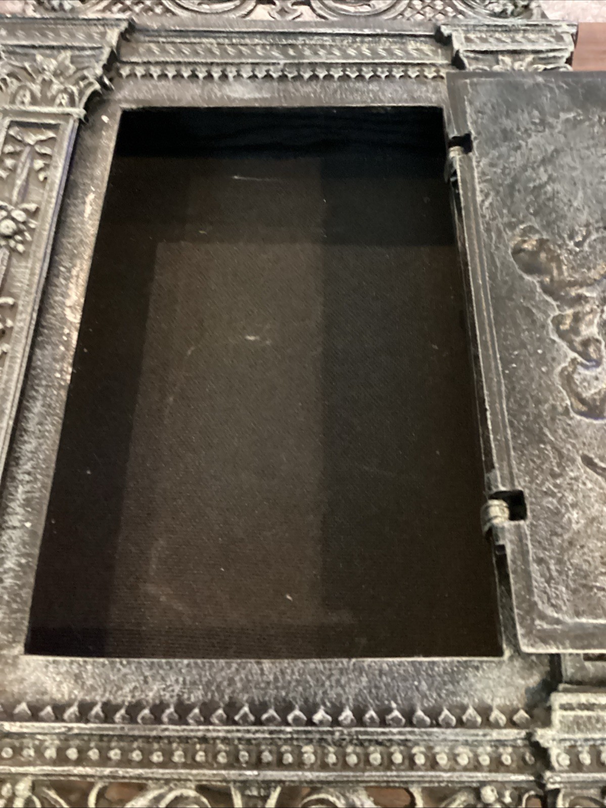 Antique cast iron fireplace door repurposed into wall mounted safe/jewelry box