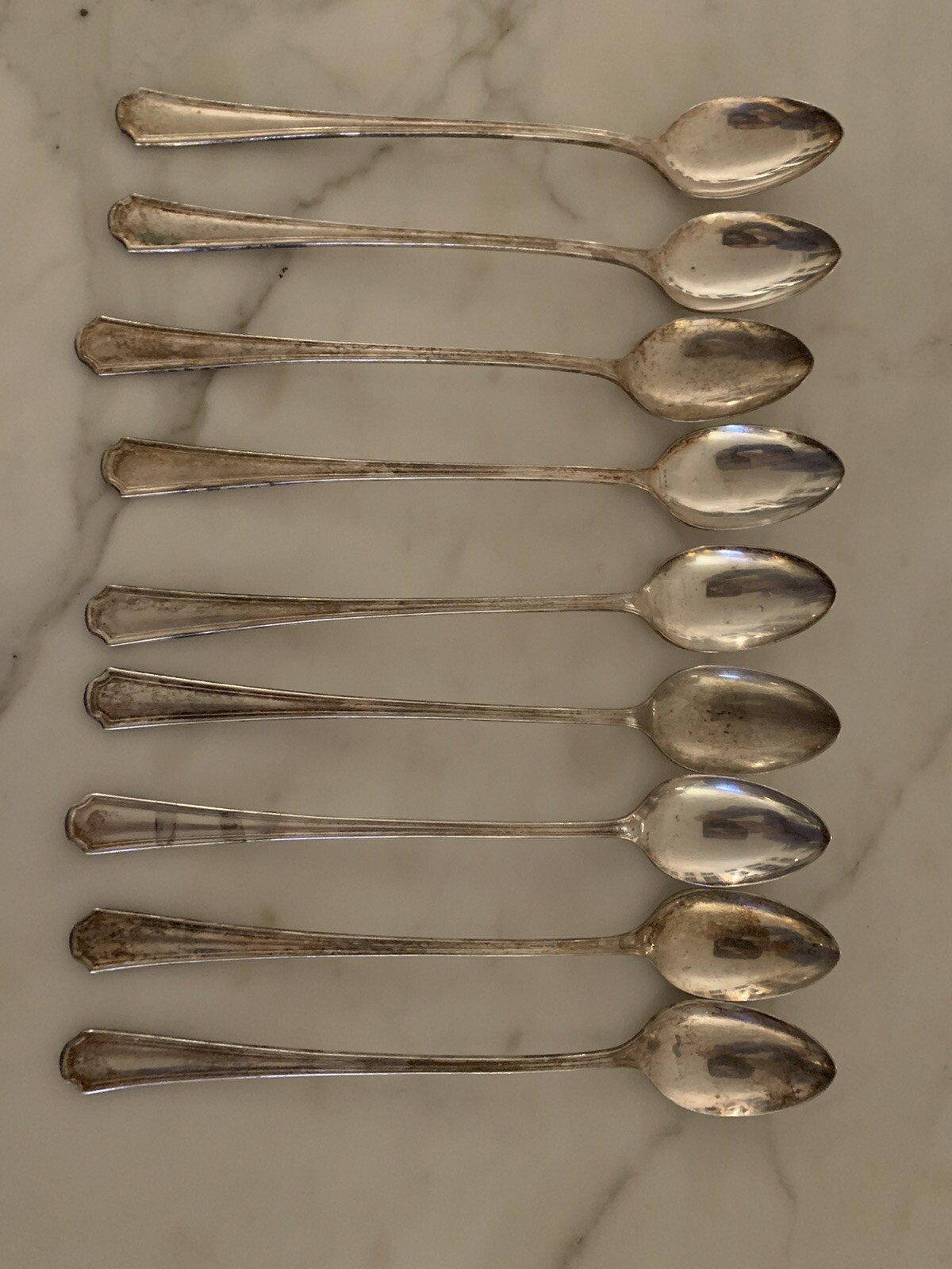 Set of ANTIQUE COLLECTIBLE ICED TEA SPOONS (9) 7.5″, 1877 N.F.CO SILVER PLATE
