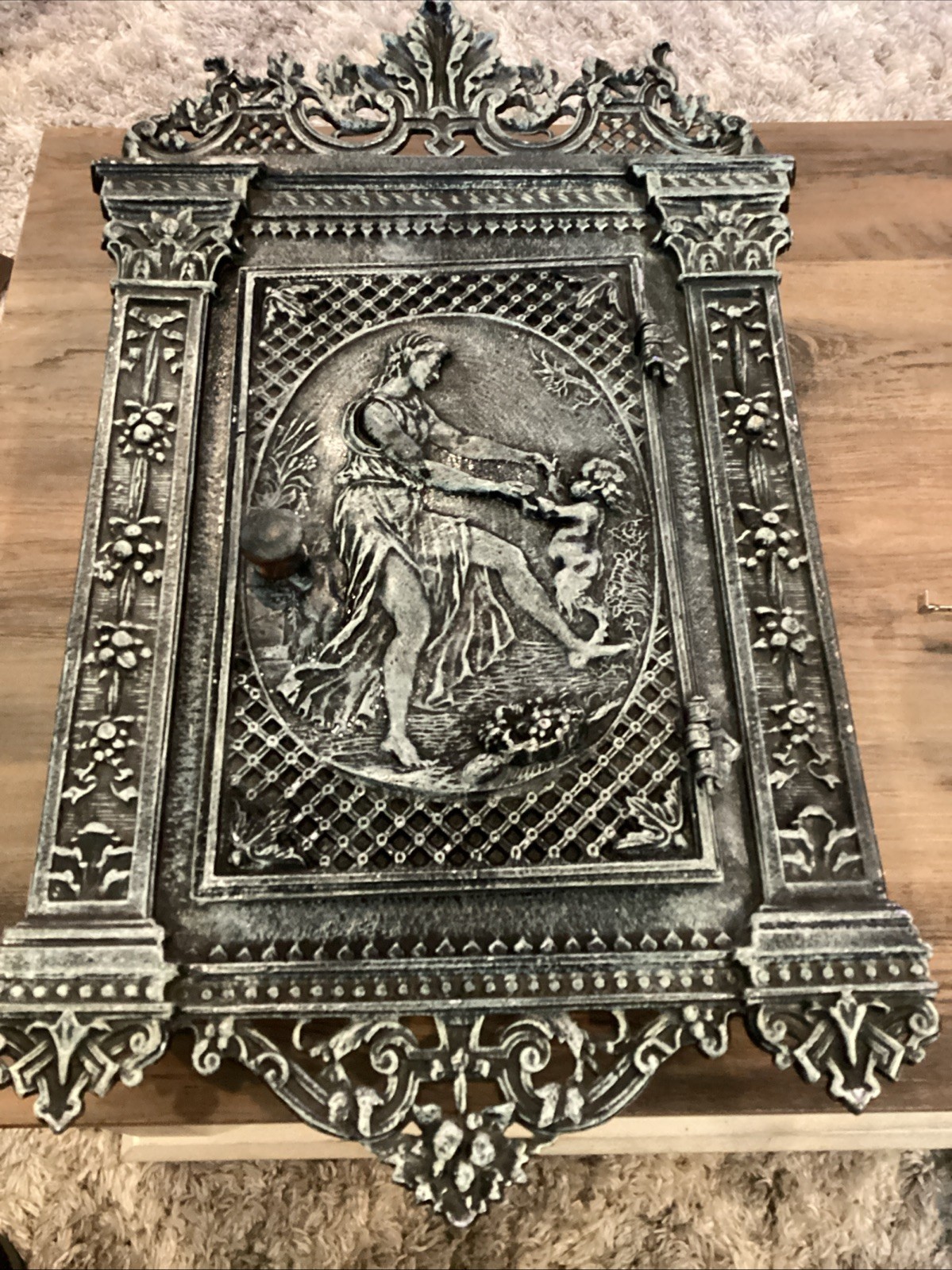 Antique cast iron fireplace door repurposed into wall mounted safe/jewelry box