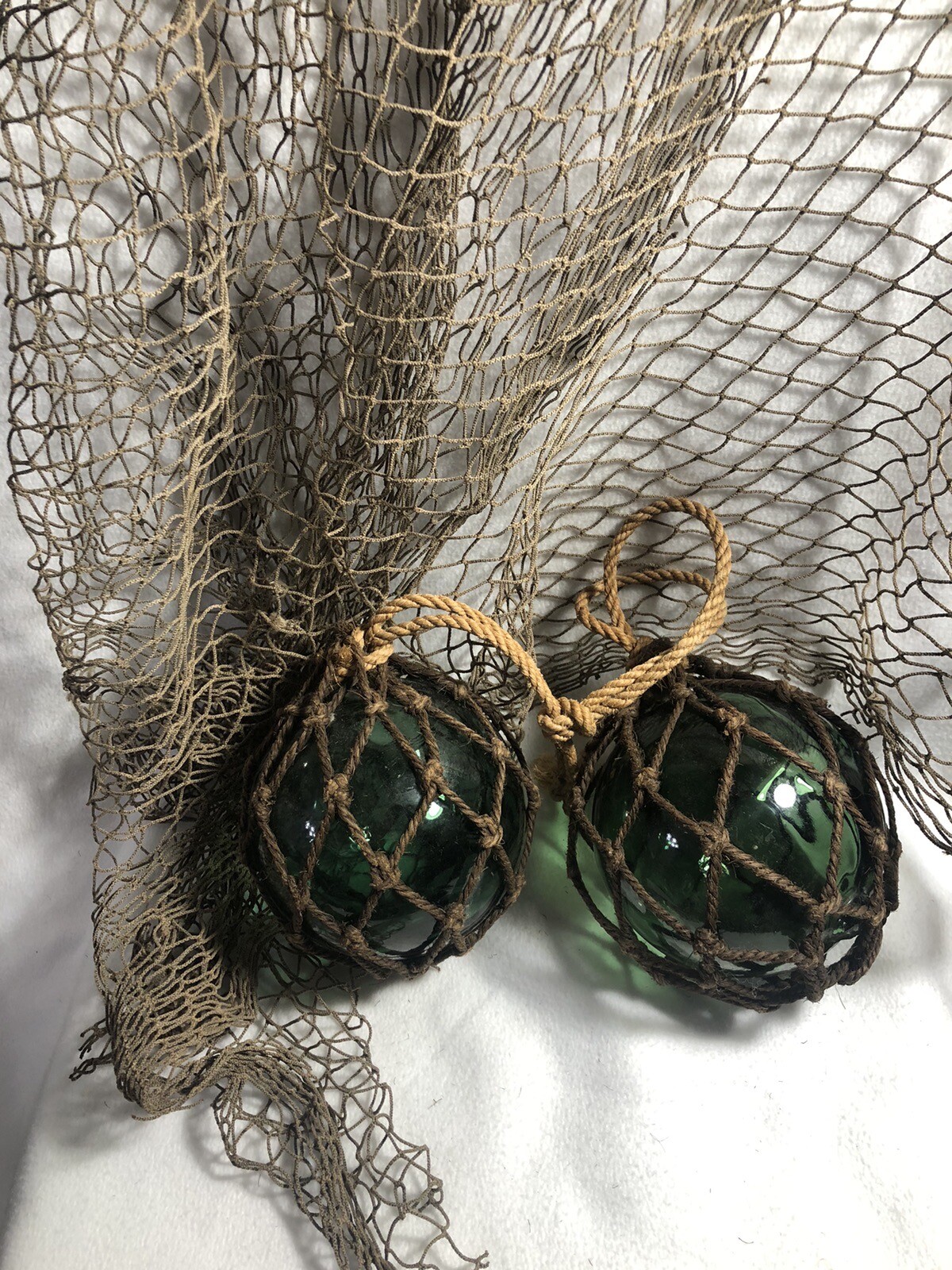 (2) VTG 60s Green Glass 5″ Fishing Floats Buoys w/Fishnet From SW ICELAND Coast