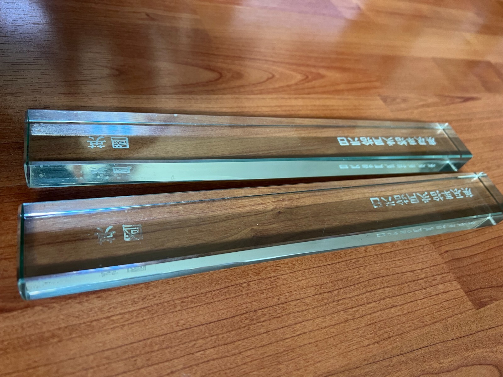 Pair of chinese grass paper scroll weights carved date and england
