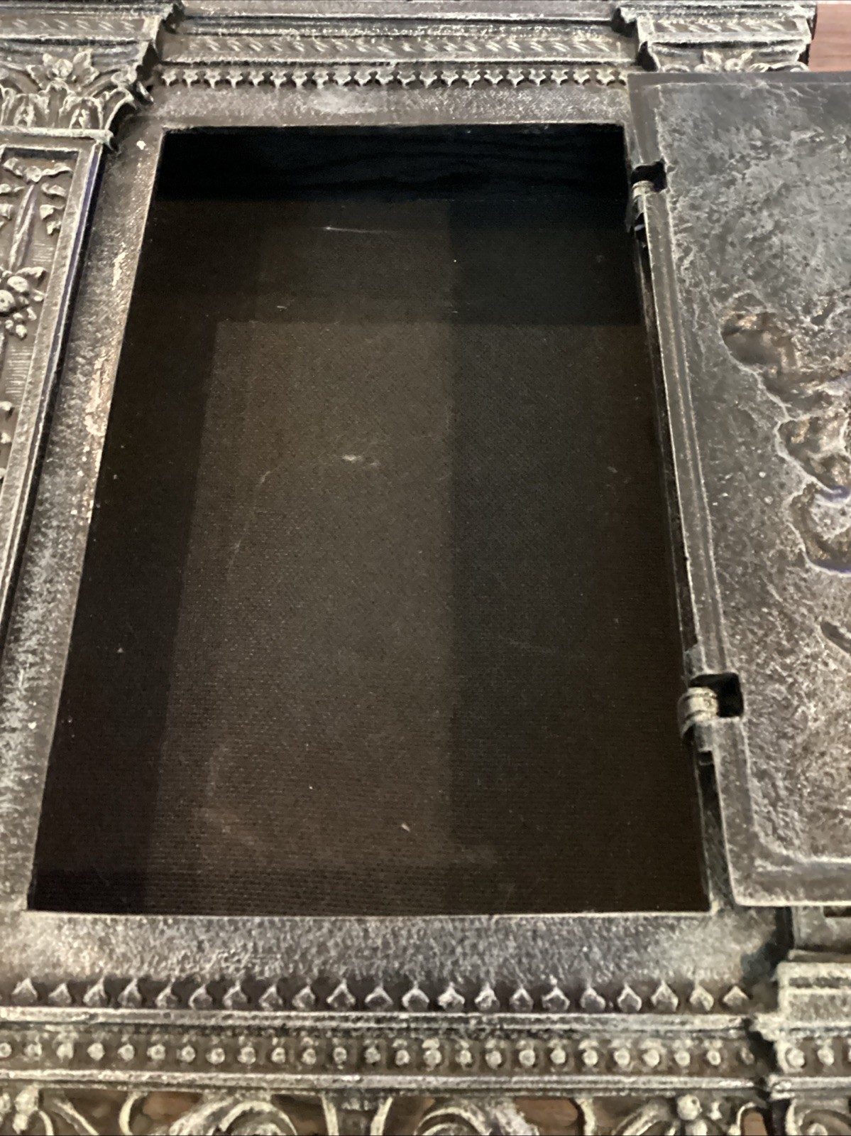 Antique cast iron fireplace door repurposed into wall mounted safe/jewelry box