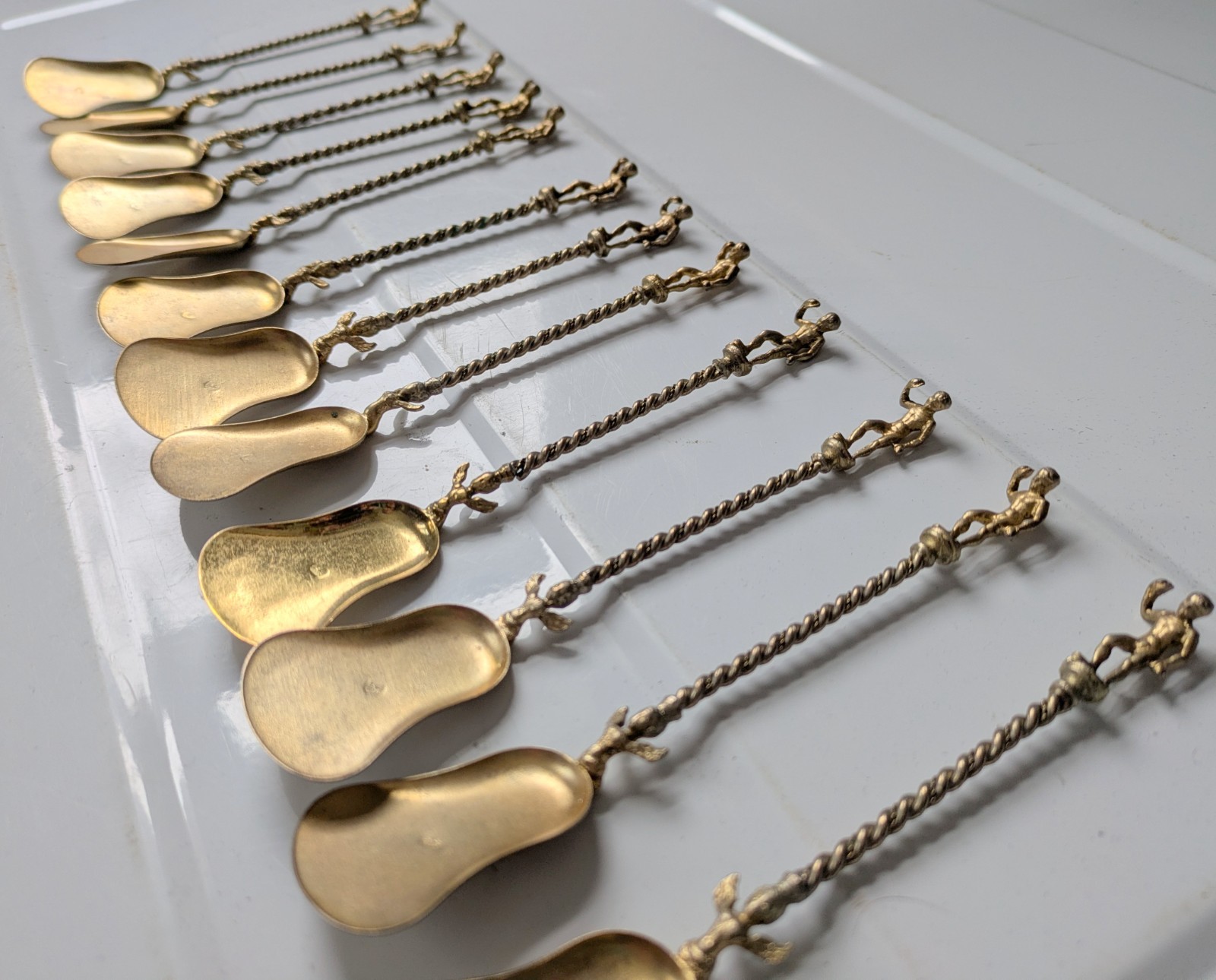 Set of 12 Vintage Italian Souvenir Gold Tone Spoons Man or Boy Topper Montagnani